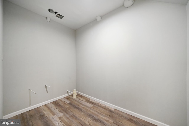 unfurnished room featuring wood-type flooring