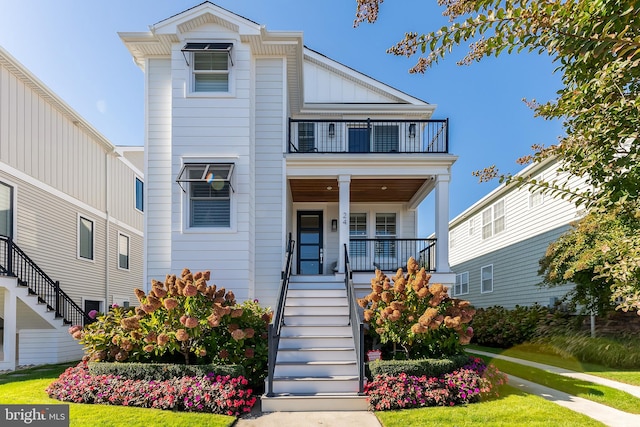 view of front of home featuring covered porch and a balcony