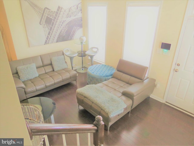 living room with dark hardwood / wood-style flooring