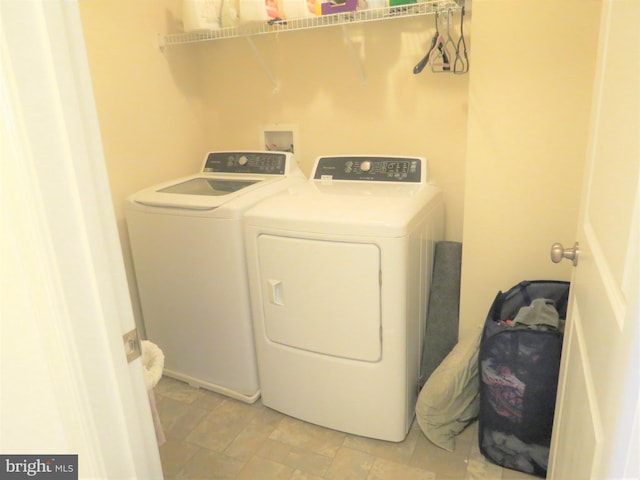 washroom featuring independent washer and dryer