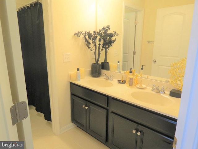 bathroom featuring vanity, tile patterned floors, and walk in shower