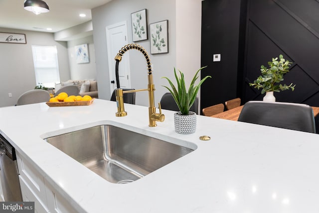 interior details with stainless steel dishwasher and sink