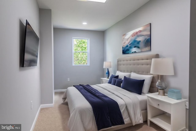 bedroom with light colored carpet