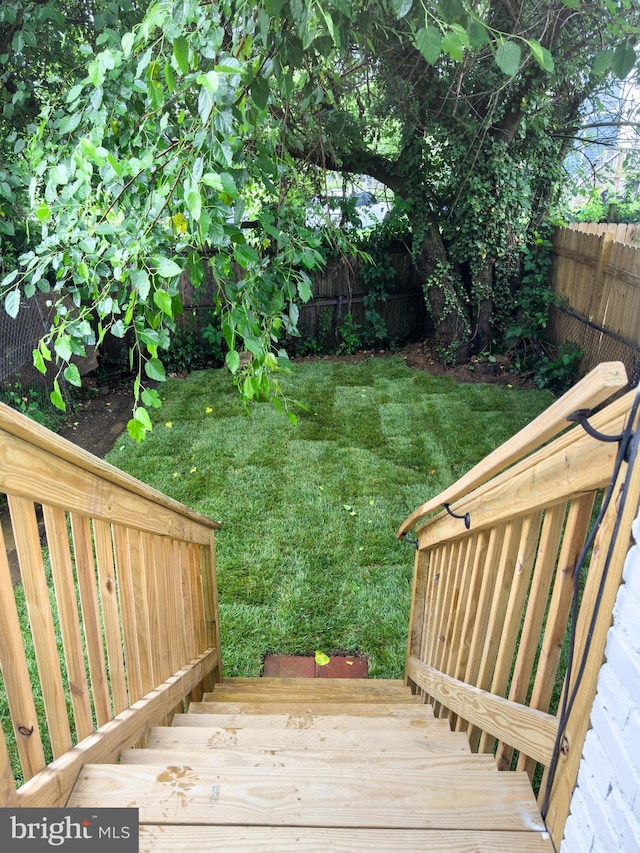 wooden deck with a yard