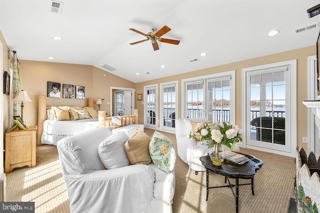 carpeted bedroom with ceiling fan, access to exterior, and vaulted ceiling