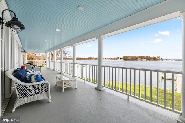 view of patio with a water view