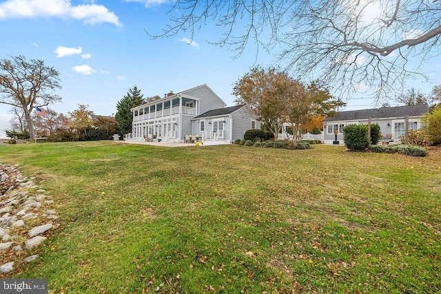 view of yard featuring a sunroom