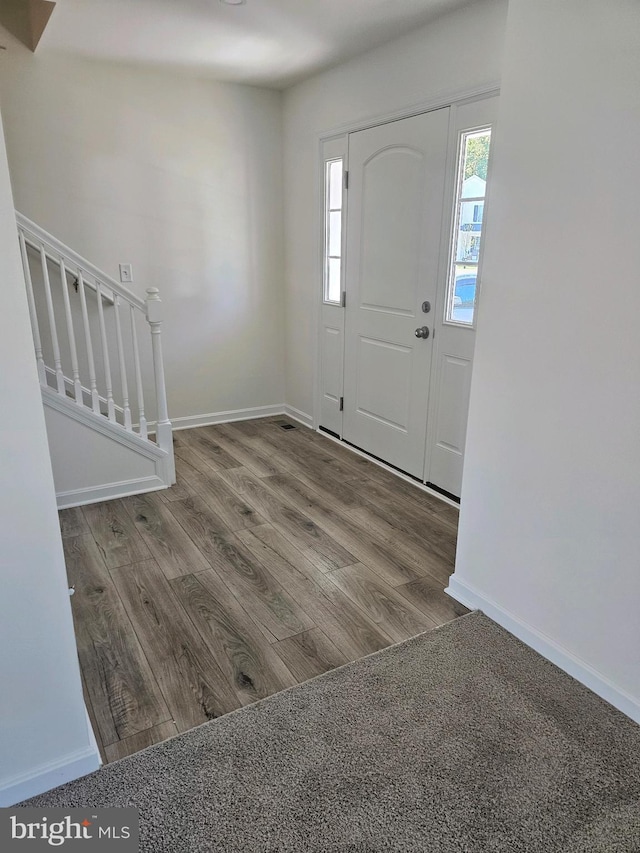 foyer entrance with hardwood / wood-style floors