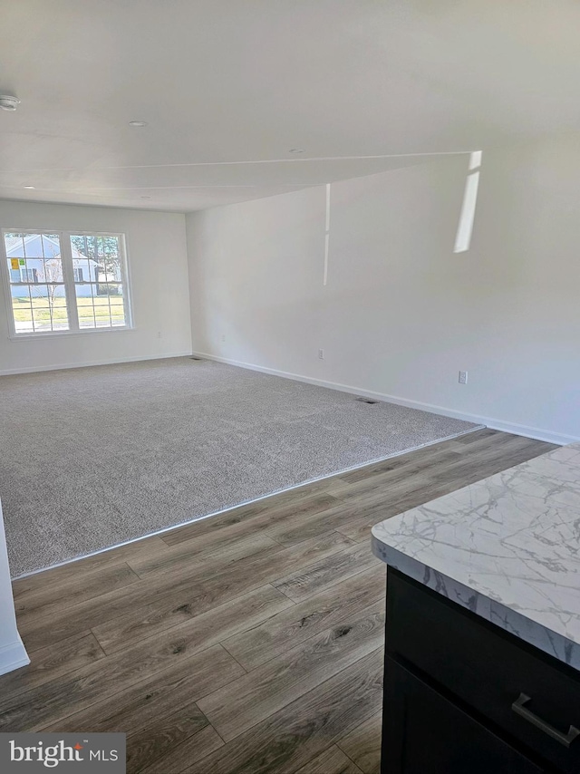 1562 N Little Creek Rd Lot 4A, Dover, DE 19901 - unfurnished living room with baseboards, dark wood finished floors, and dark colored carpet