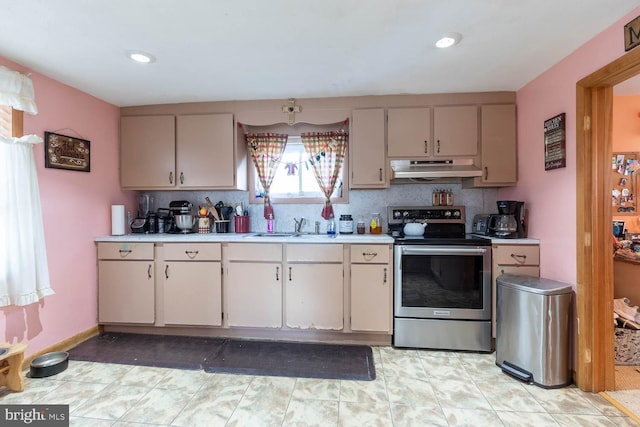 kitchen with stainless steel electric range and sink