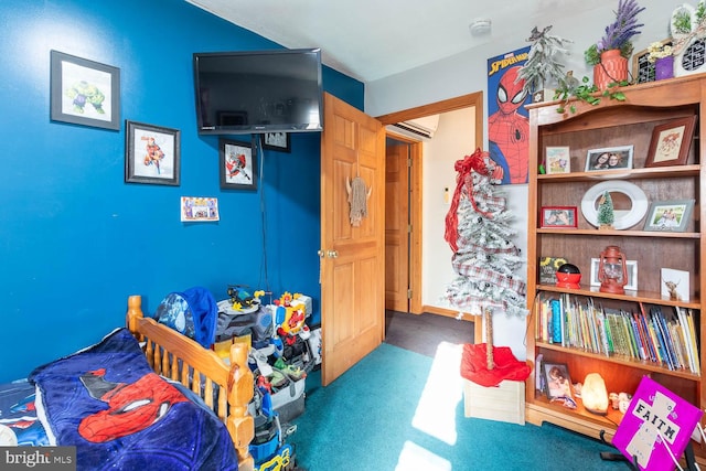 bedroom featuring carpet floors and a wall mounted air conditioner