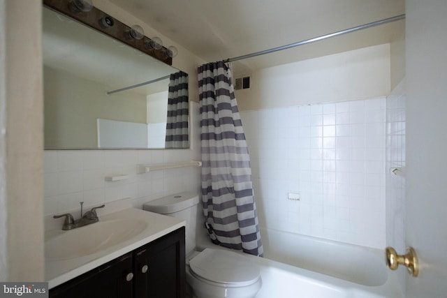 full bathroom featuring toilet, tasteful backsplash, tile walls, shower / tub combo, and vanity