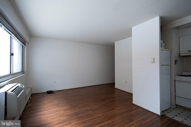 2101 Chestnut St Unit 401, Philadelphia, PA 19103 - unfurnished living room featuring wood finished floors and a wall unit AC