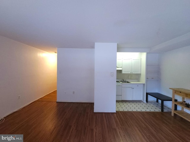 unfurnished living room featuring dark hardwood / wood-style flooring