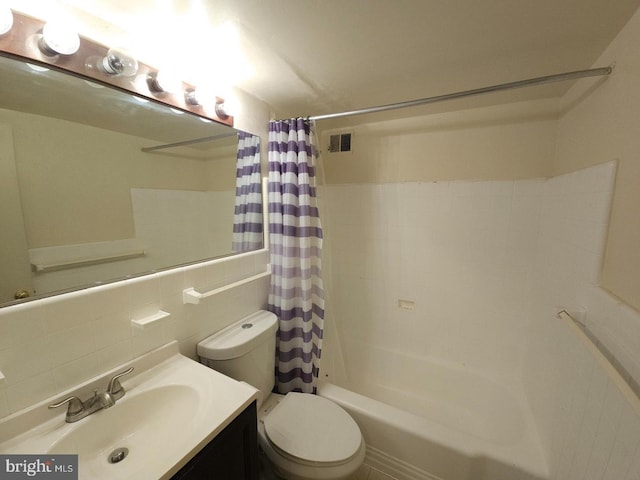 full bathroom with shower / tub combo, toilet, vanity, tile walls, and decorative backsplash