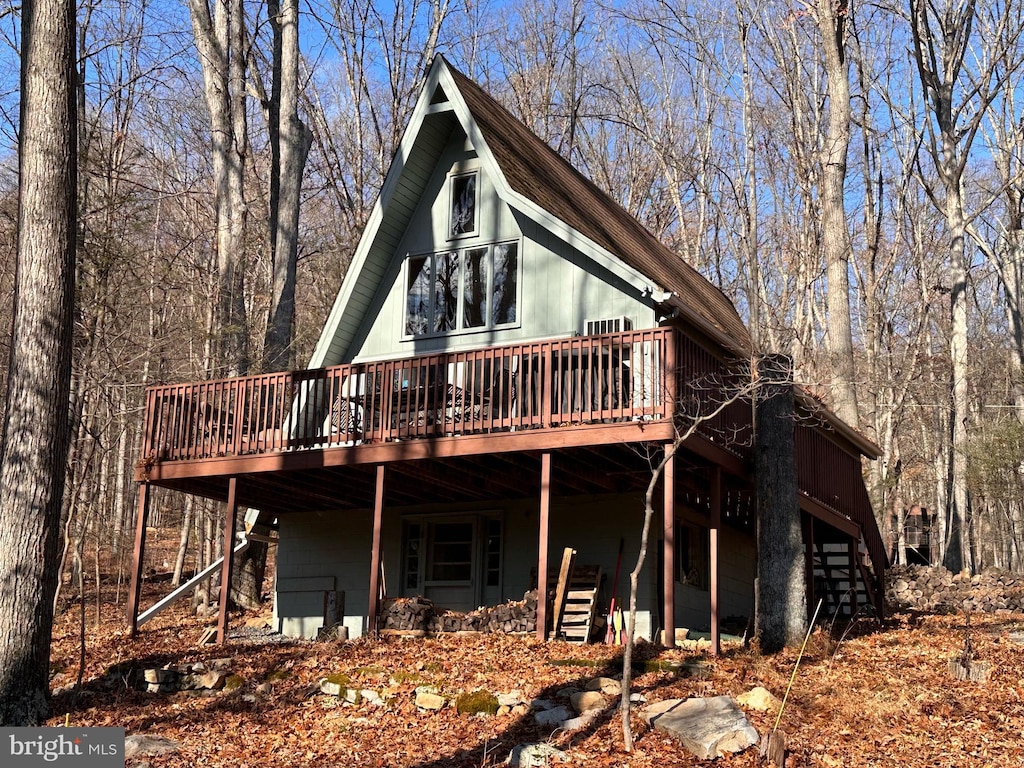 rear view of property with a deck