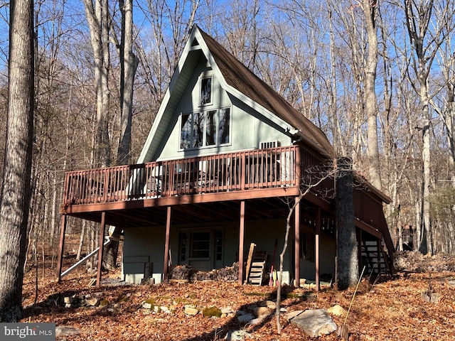 rear view of property with a deck