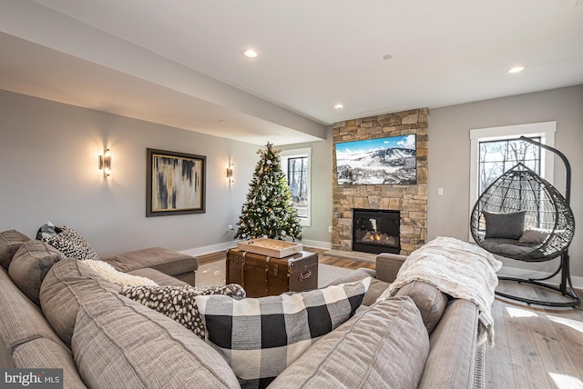 living room featuring a fireplace and light hardwood / wood-style flooring