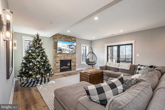 living room featuring hardwood / wood-style flooring and a fireplace