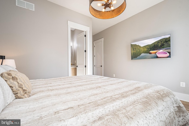 bedroom featuring hardwood / wood-style floors