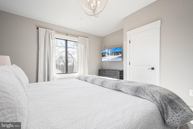 bedroom featuring lofted ceiling