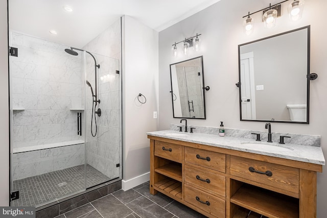 bathroom with vanity, an enclosed shower, and toilet