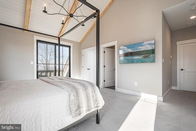 carpeted bedroom with wooden ceiling, access to outside, high vaulted ceiling, an inviting chandelier, and beam ceiling