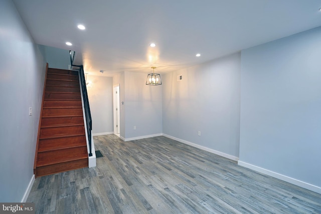 basement with hardwood / wood-style floors