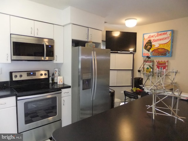 kitchen featuring white cabinets and appliances with stainless steel finishes