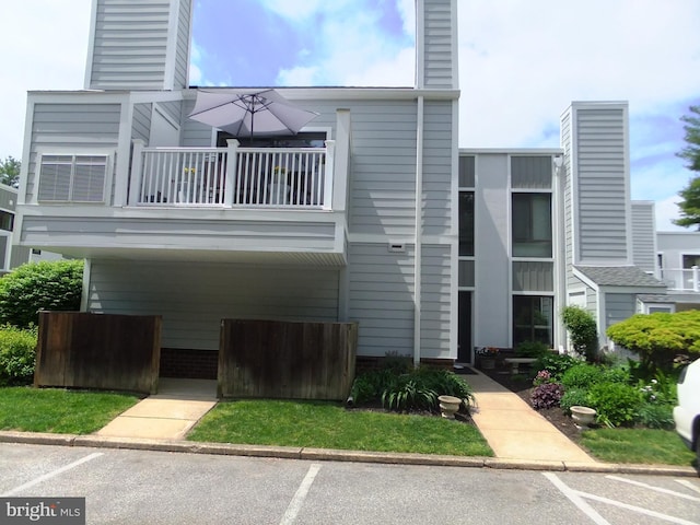 1710 Oakwood Ter Unit 3E, Penn Valley, PA 19072 - view of building exterior featuring uncovered parking