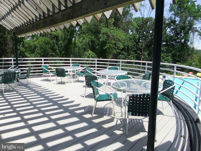 1710 Oakwood Ter Unit 3E, Penn Valley, PA 19072 - wooden terrace with outdoor dining space and view of scattered trees