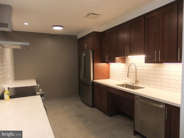 1710 Oakwood Ter Unit 3E, Penn Valley, PA 19072 - kitchen featuring stainless steel appliances, a sink, light countertops, backsplash, and dark brown cabinets