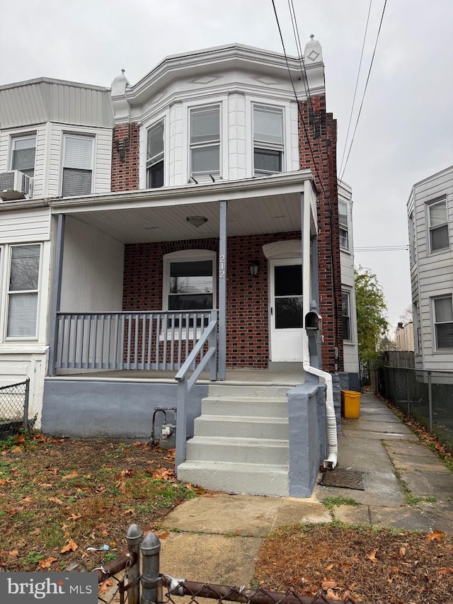 townhome / multi-family property with covered porch