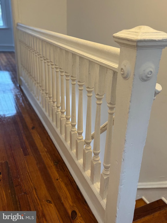 stairs with hardwood / wood-style flooring