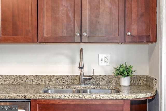 room details featuring stainless steel dishwasher and sink