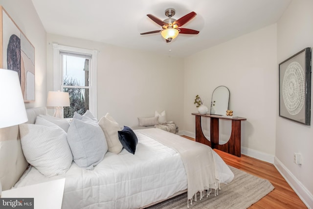 bedroom featuring light hardwood / wood-style floors and ceiling fan