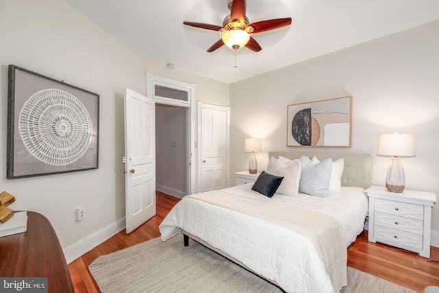 bedroom featuring ceiling fan and light hardwood / wood-style floors