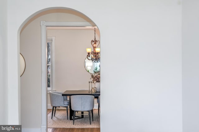 interior space featuring a chandelier and light hardwood / wood-style flooring