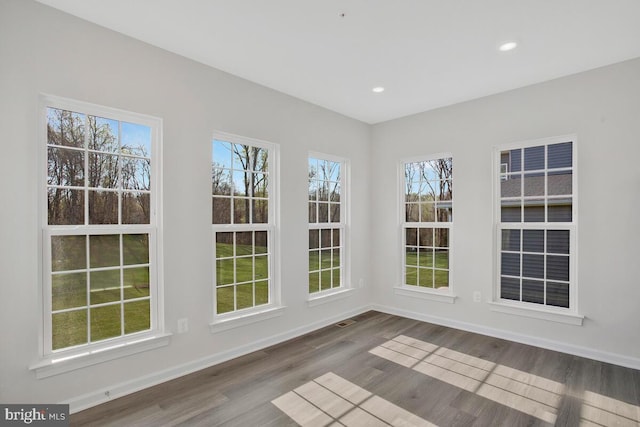 unfurnished sunroom with plenty of natural light