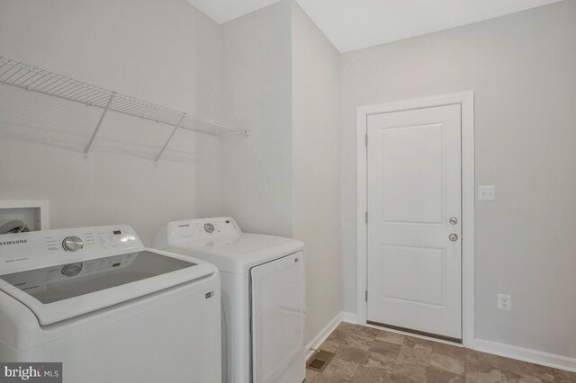 washroom with separate washer and dryer