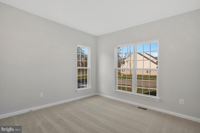 unfurnished room featuring carpet floors