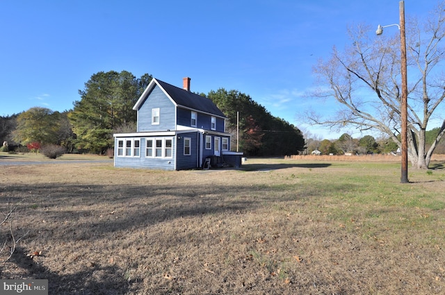 view of home's exterior featuring a yard