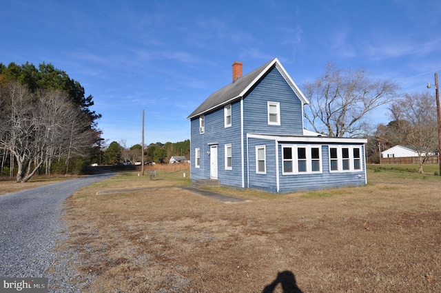 view of property exterior featuring a yard