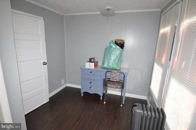 interior space featuring ornamental molding, dark wood-type flooring, and radiator