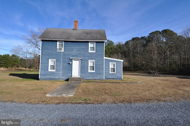 view of front of home with a front yard