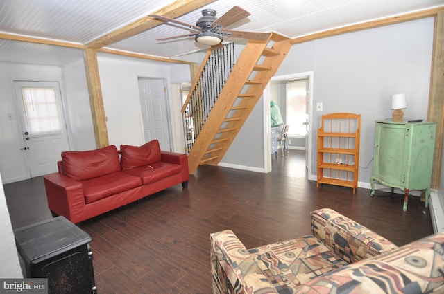 living room featuring dark hardwood / wood-style flooring and ceiling fan