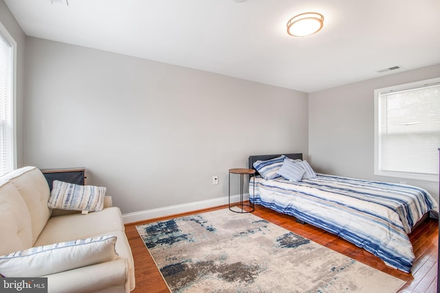 bedroom with wood-type flooring