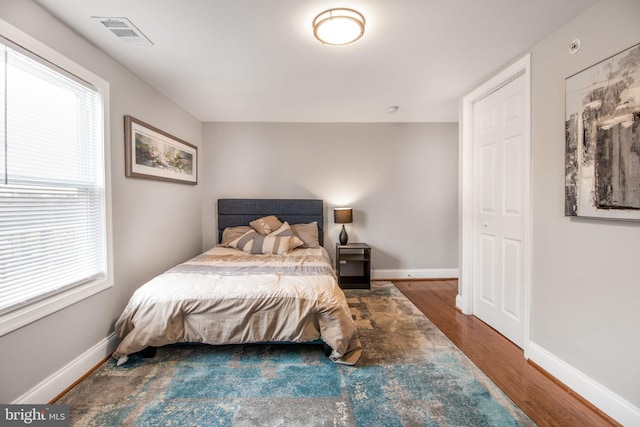 bedroom featuring dark hardwood / wood-style floors