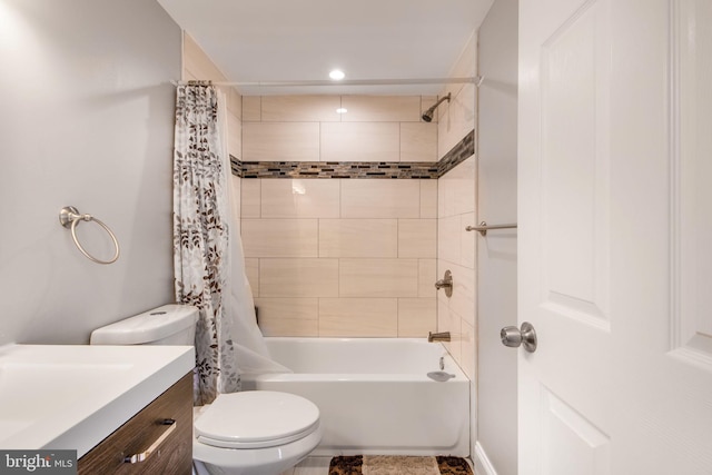 full bathroom featuring vanity, toilet, and shower / bath combo with shower curtain