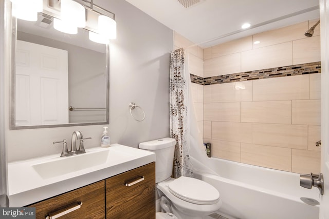 full bathroom featuring vanity, toilet, and shower / bathtub combination with curtain